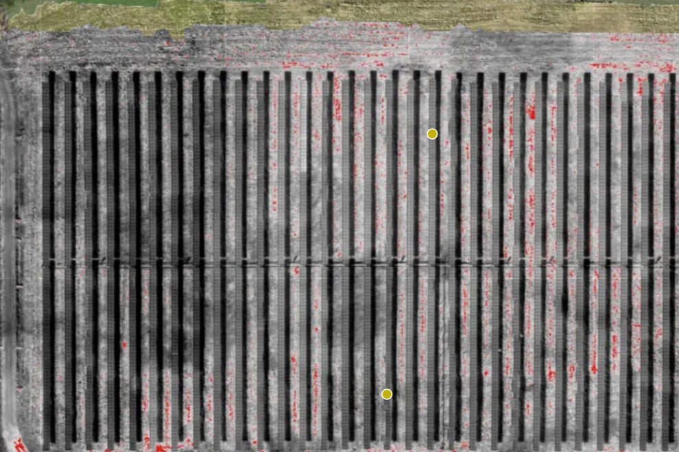 Thermal inspection of a solar farm with hot cells flagged in red